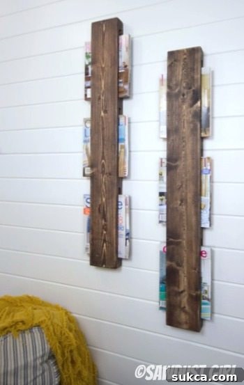 Finished Magazine Rack A finished, super cheap and easy DIY wall mounted wood magazine rack displayed in a home setting.