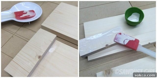 Wood Glue Application Applying wood glue with a spreader tool for strong adhesion on wooden blocks.