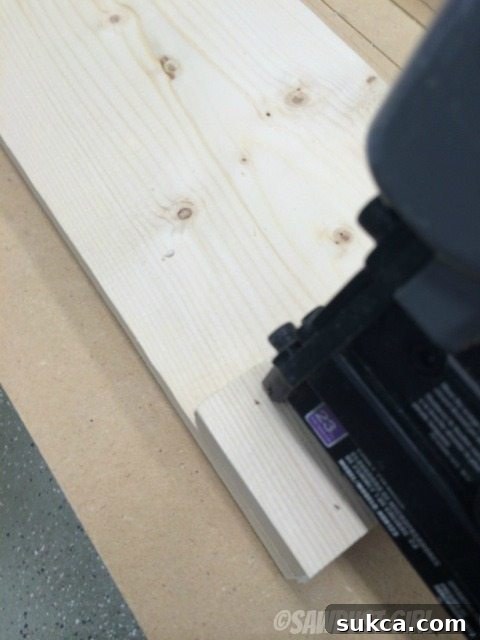 Nailing Blocks Reinforcing glued wooden blocks with a brad nailer for a durable magazine holder assembly.