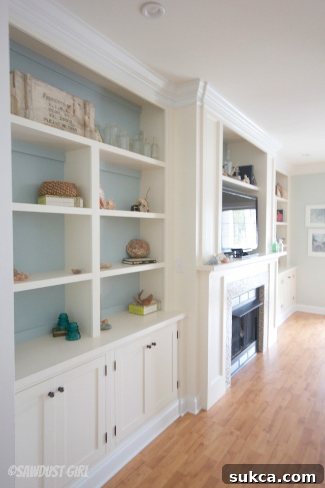 Close-up of the fireplace mantle and surrounding built-in shelving, styled with decor