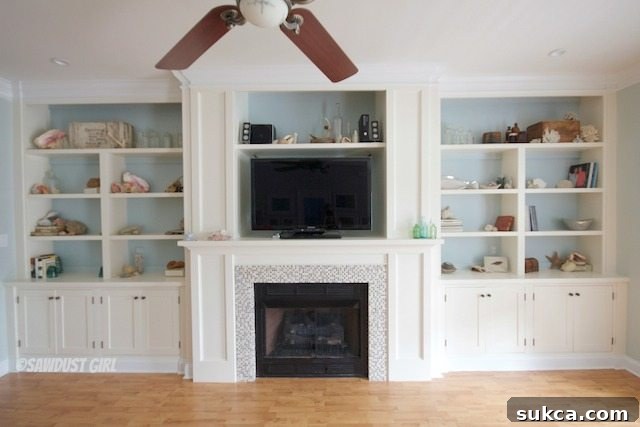 Wide shot of a beautifully decorated living room featuring custom built-ins and a fireplace