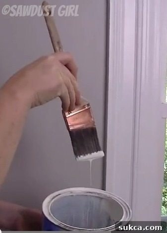 Properly loading an angled brush for cutting in paint, dipping only the tip