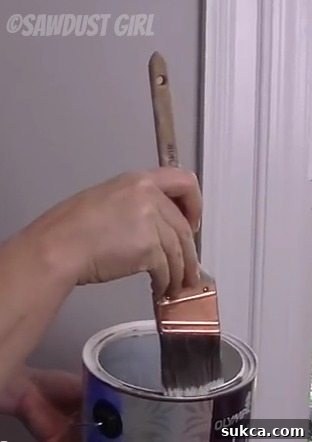 Technique for offloading excess paint from one side of the brush before "cutting in"