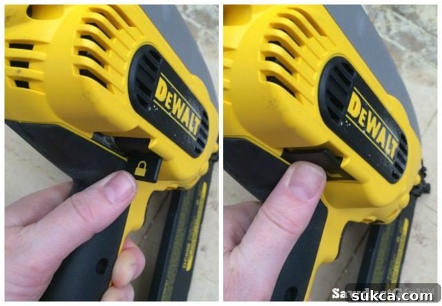 Detail of the safety lockout switch on a DeWalt cordless nail gun