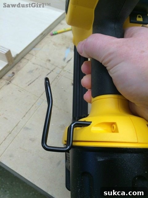Convenient reversible belt hanger feature on a DeWalt cordless finish nailer