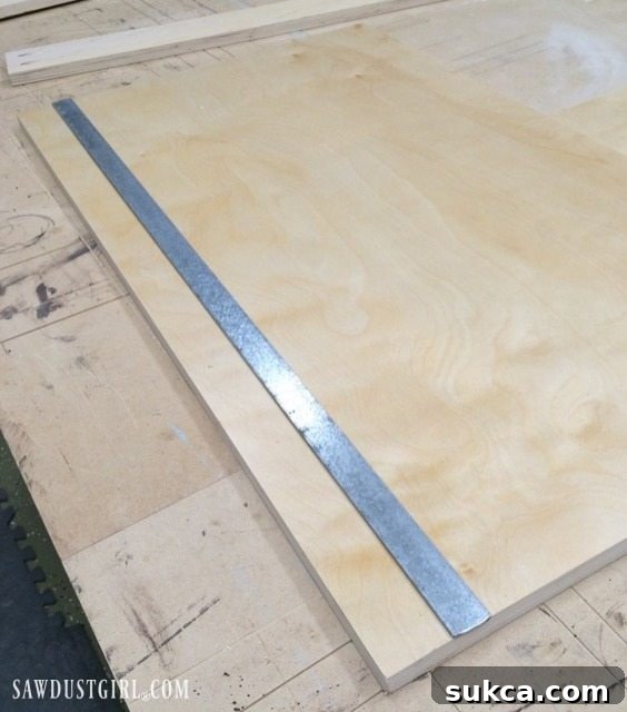 Detailed view of the groove cut into the cabinet bottom for the sliding door track