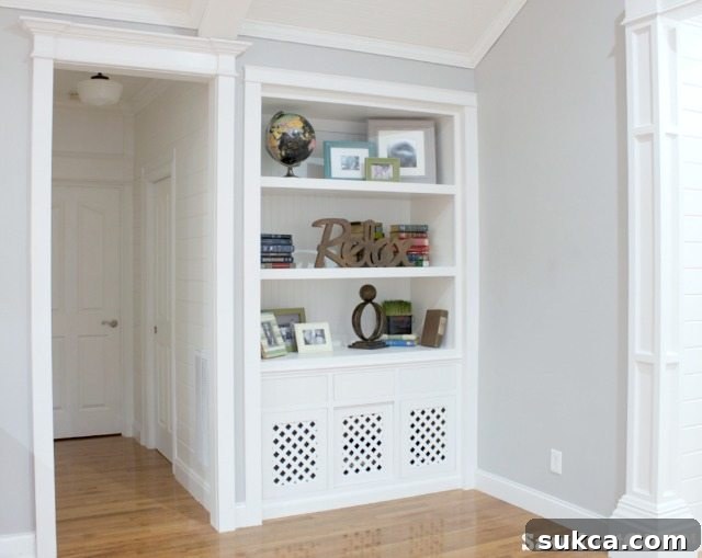 Detailed view of elegant white hallway trim molding, showcasing intricate profiles and clean lines.
