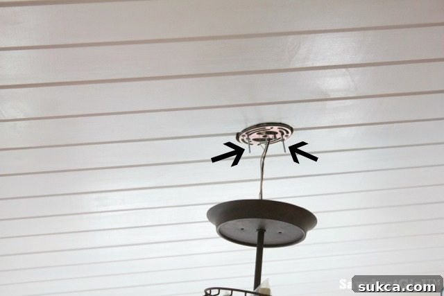 Adjusting the length of mounting bolts to secure a light fixture