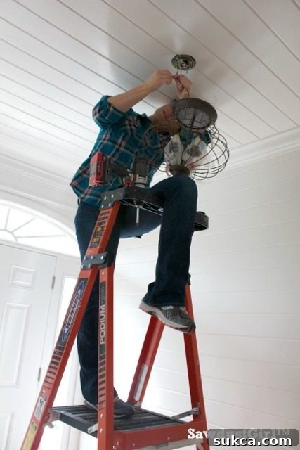 Supporting the weight of the light fixture during wiring
