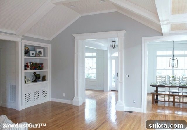 Living room with elegantly crafted box-beam ceiling, showcasing modern farmhouse style.