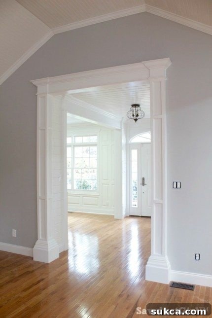 Foyer leading to the library, adorned with elegant entrance columns and architectural details.