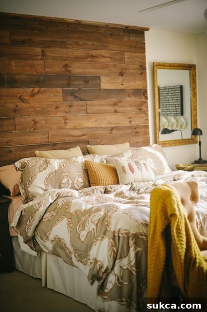 Striking Tall Rustic Wood Headboard for a Master Bedroom