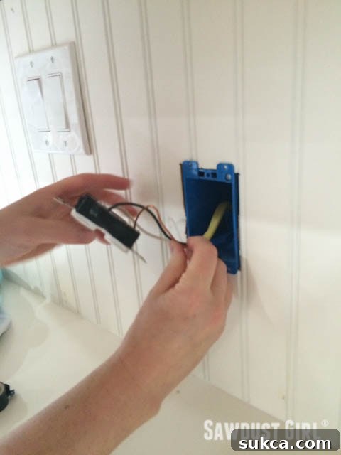 Fitting Outlet into Junction Box How to wire an electrical outlet: Placing outlet in box