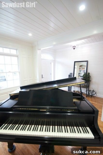 black kawai baby grand in library