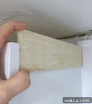 Filler strip installed to create a flush surface for crown molding.