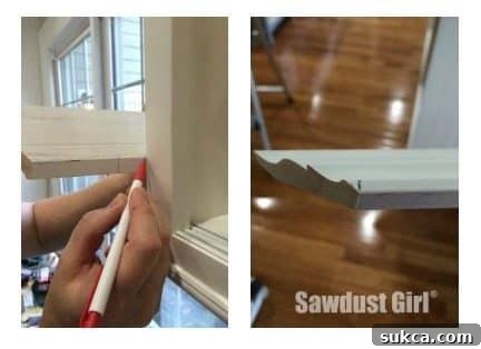 Marking crown molding pieces directly on the cabinet for precise cuts.