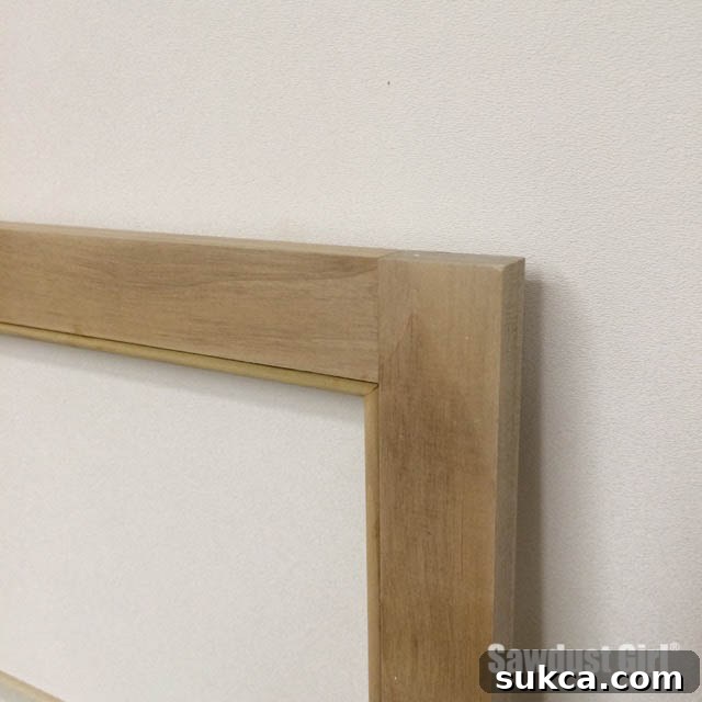 Using a brad nailer to attach beading to a cabinet face frame