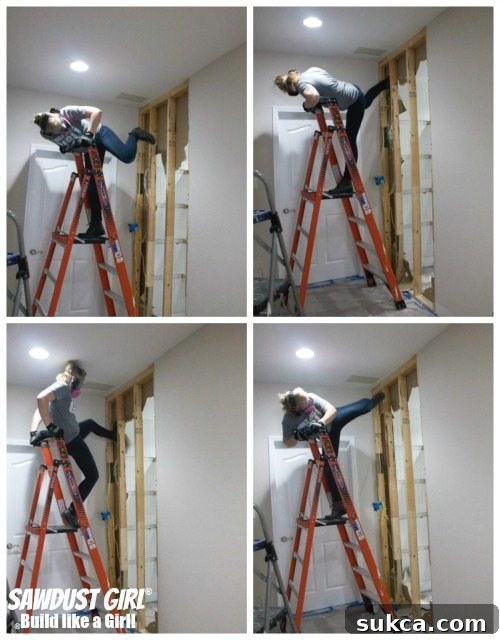 The moment of realization: attempting to kick through a framed ceiling, a common but amusing mistake in the midst of intensive home demolition.