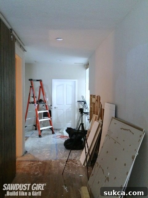 Extensive drywall removal reveals the complexity of home remodeling, uncovering electrical wiring and structural elements during a significant renovation project.