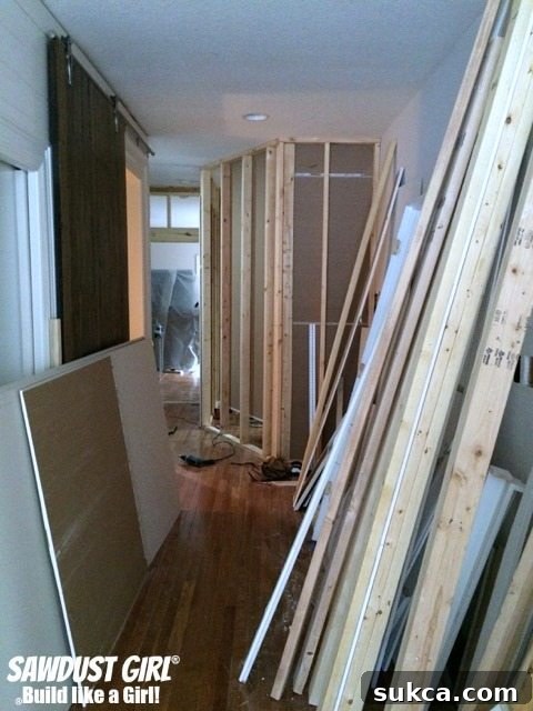 Our new pantry, freshly drywalled and visible from the hallway, showcasing the beginning of a magnificent home transformation.