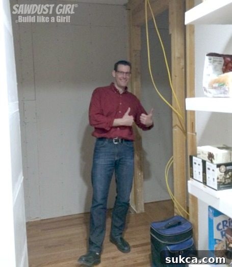 Wes's delighted reaction upon seeing the new, expansive pantry, a clear sign of a successful and much-appreciated home transformation.