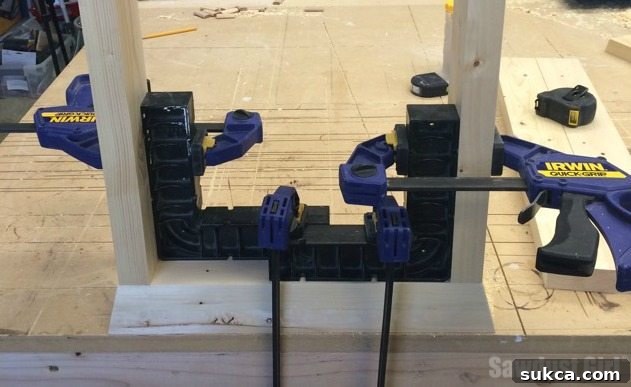 Clamping legs of a wood console table to ensure squareness during glue setting