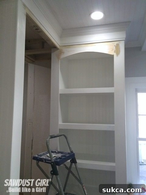 The finally approved elegant arch design installed in the custom display cabinet