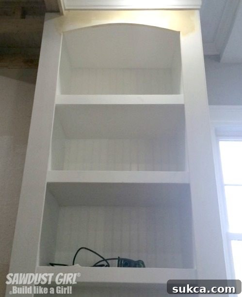 Close-up of the newly installed arch and cabinet interior during the renovation process