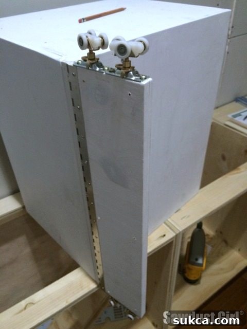 The Ultimate Space-Saving DIY Corner Cabinet 18 Mounting Wheels on Free-Swinging Cleat for Cabinet Pull-Out