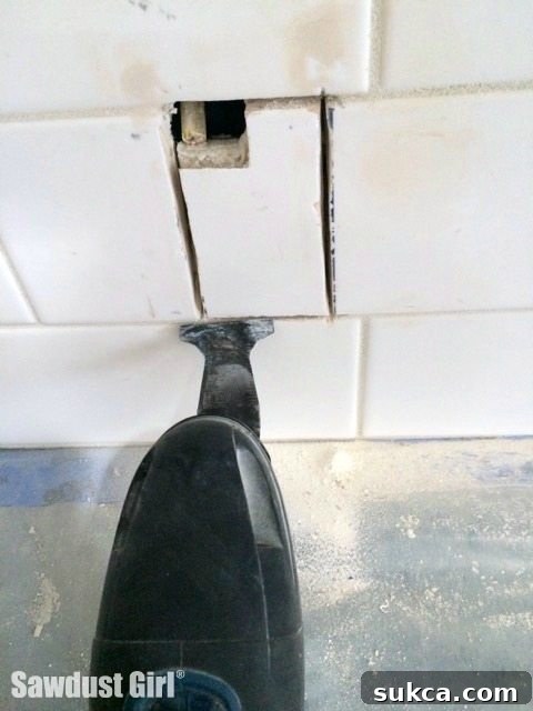 Oscillating Tool for Precision Corners Cutting tile corners with oscillating tool