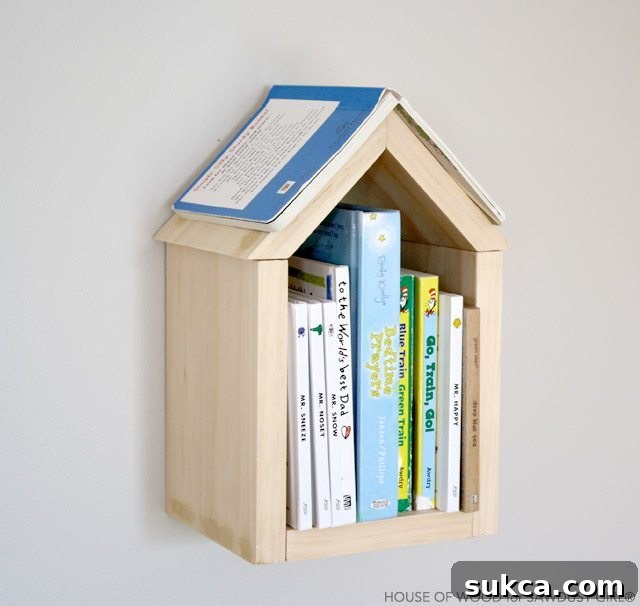 Adorable pink house shelf in a child's bedroom