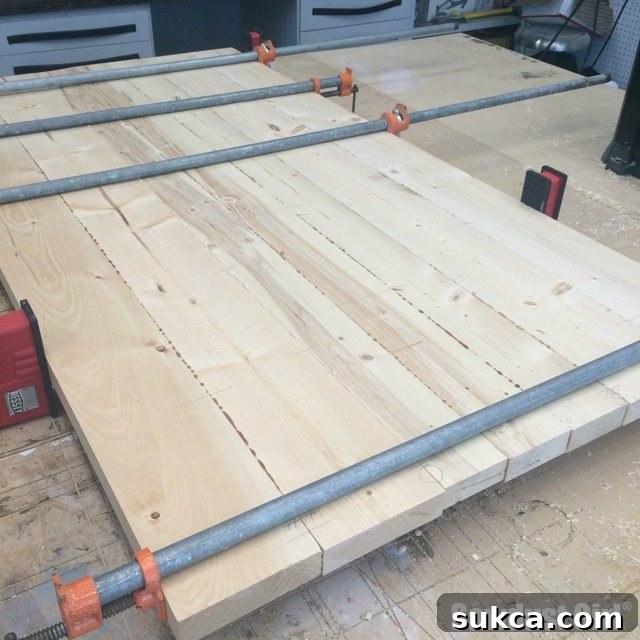 Close-up of a partially assembled wood countertop section, showcasing tight joints.