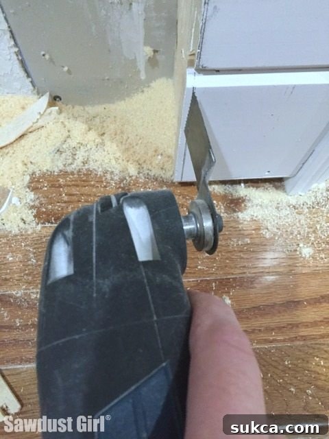 Flush trim with an oscillating multi-tool for perfect plank wall edges