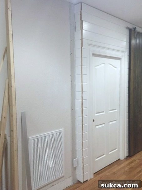 Unfinished plank wall corners showing raw edges