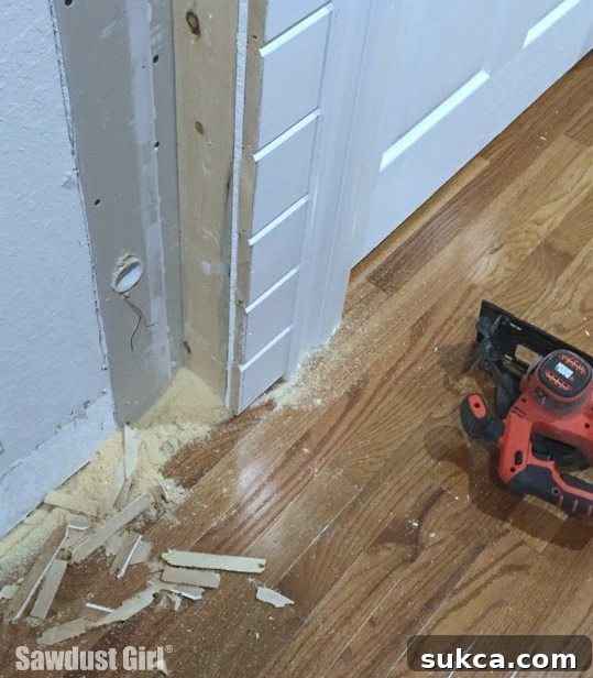 Sawdust accumulated from trimming a plank wall