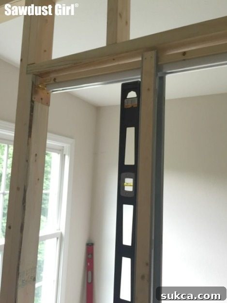 Leveling and Securing Split Jambs How to install a pocket door frame ~ https://sawdustgirl.com