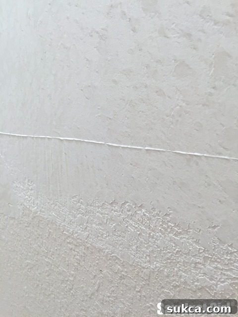 Revealing the smooth surface after effectively removing old wall texture through skim coating