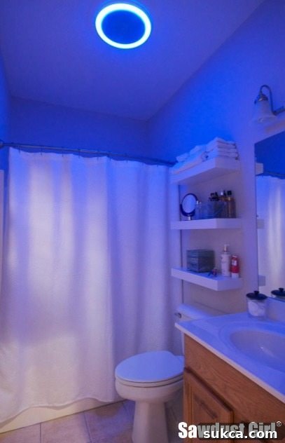 Small bathroom storage solution with blue LED light