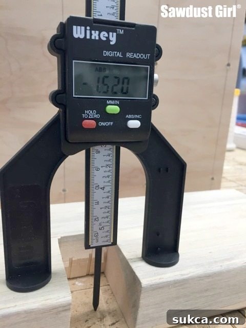 Accurate dado depth displayed on the digital gauge Measuring dado depth with a digital height gauge spindle