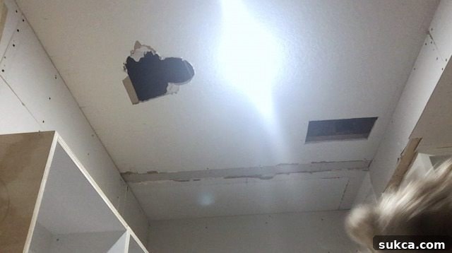 Pantry Ceiling Holes Revealed Ceiling holes needing repair in the pantry