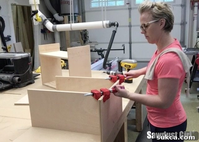 User demonstrating the single-handed release of a Bessey Angle Clamp.