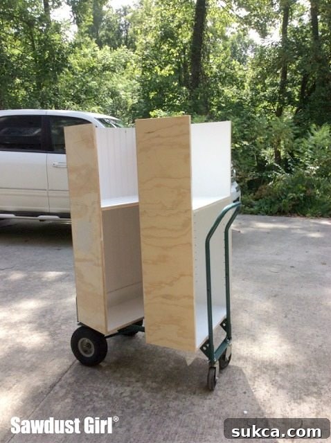 Pantry cabinet assembly in progress, showing the initial structure of the cabinet frame, ready for finishing.