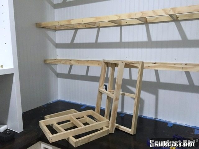 Corner Floating Shelf Framework Corner perspective of the pantry with both long and short floating shelf ribs installed, forming the complete L-shaped framework.
