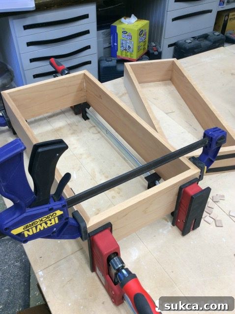 Clamping three tier shelf boxes for glue-up