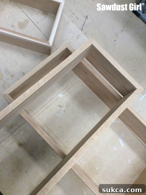Arranging boxes for the three tier display shelf design