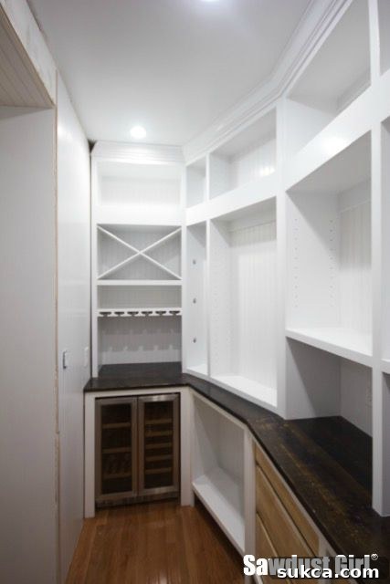 A nearly completed pantry space Pantry view with installed crown molding and future plans