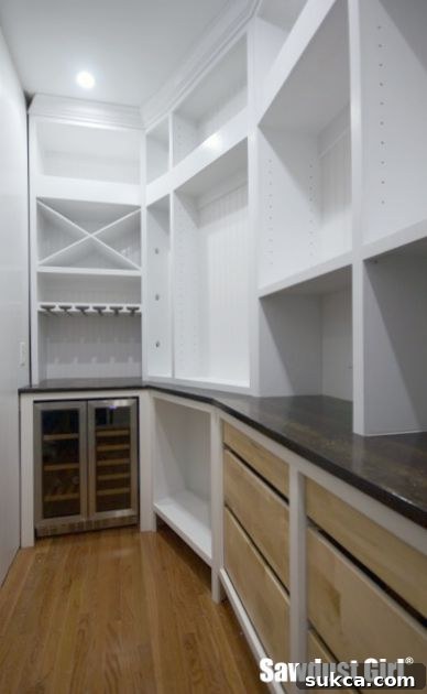 Modern and functional pantry design Pantry interior with white cabinetry and wood accents