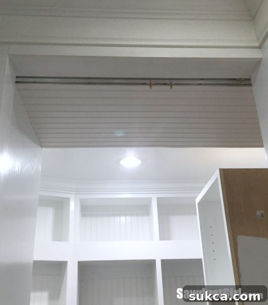 Installing the bypass door track system for custom pantry pocket doors.