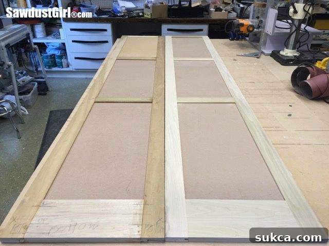 Doors after initial sanding, showcasing perfectly smooth surfaces, ready for priming.