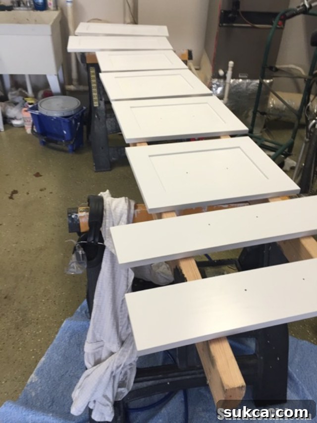 The stunning, glass-smooth finish of a newly painted cabinet door, reflecting the high quality achieved with the spray booth setup.